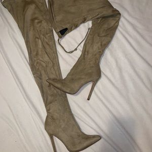 Thigh high heeled boots